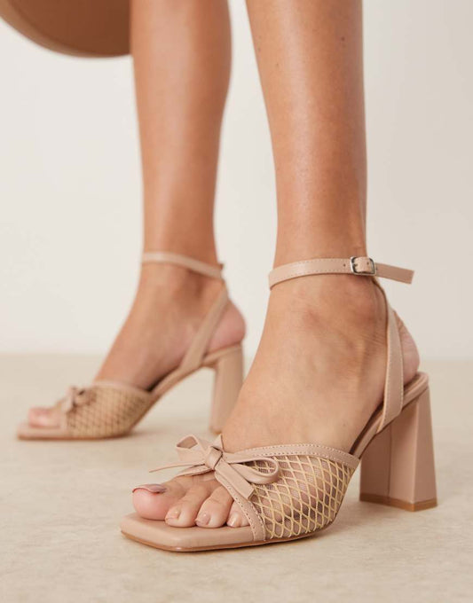 Glamorous mid block heeled bow sandals in neutral